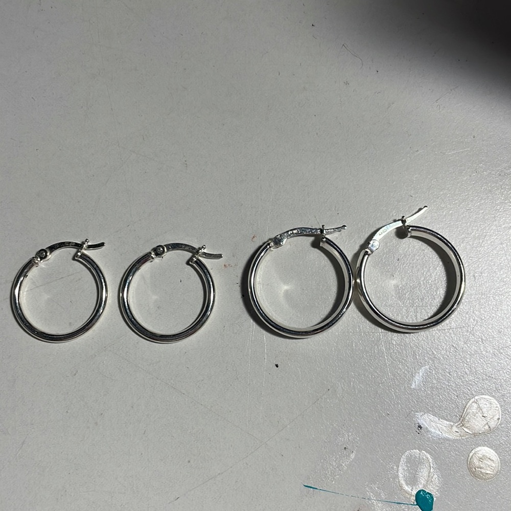 two pairs of silver hoop earrings
